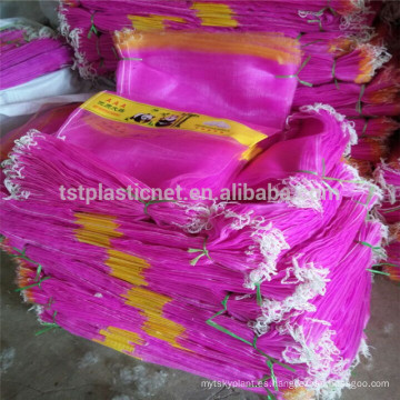 Bolso de malla de color rosa con mono de ajo en India, Pakistán y Sudamérica